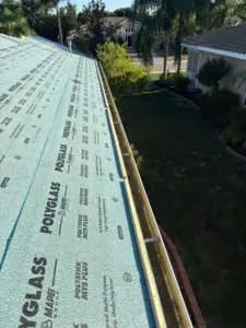 Crew installing stone-coated metal roofing in Hillsborough County