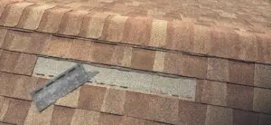 Roofers working on a residential roof repair in Hillsborough County
