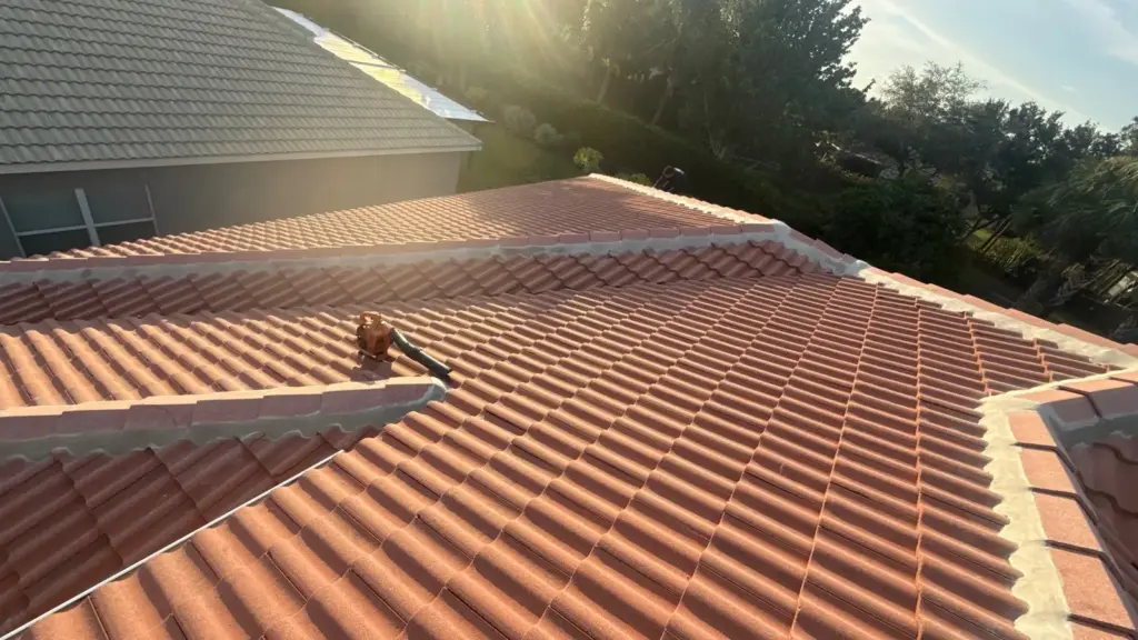 Roofer inspecting damaged section before repair in Hillsborough County