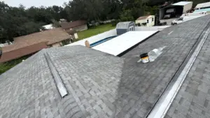 Worker replacing damaged roofing material in Seffner, FL