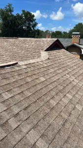 Removing damaged roofing material during a repair job in Hillsborough County