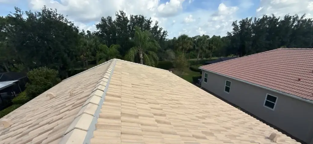 Roof repair crew assessing damage on a Hillsborough County home