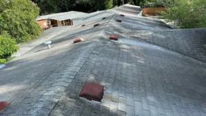 Crew installing new shingles for roof replacement in Hillsborough County