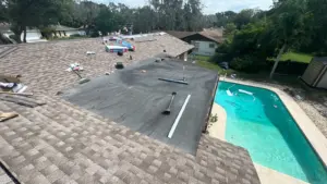 New roofing system being laid course by course on a Riverview, FL house