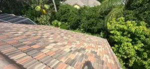 Crew setting tile courses during a roofing job in Valrico, FL