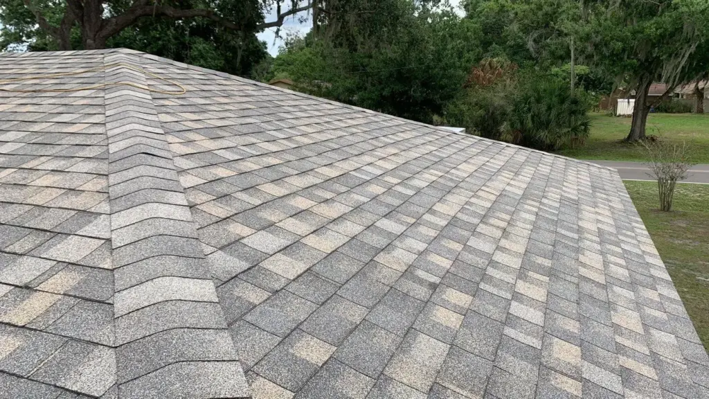 Tear-off in progress during roof replacement in Polk County