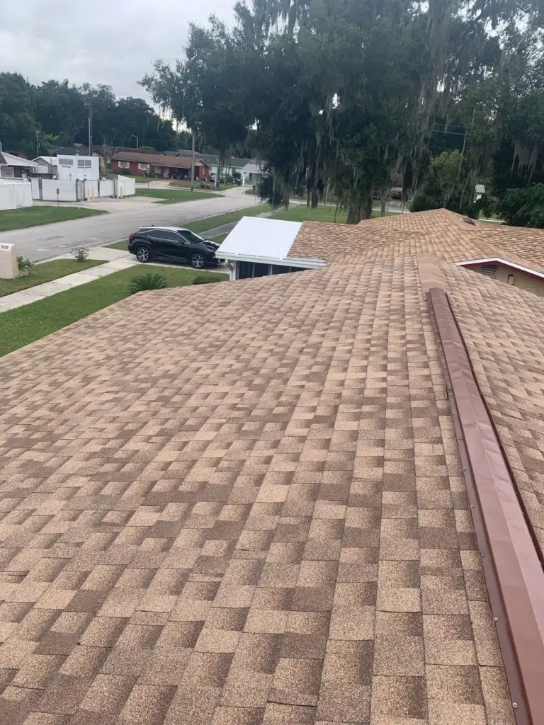 Crew tearing off old roofing during a roof replacement in Polk County, FL