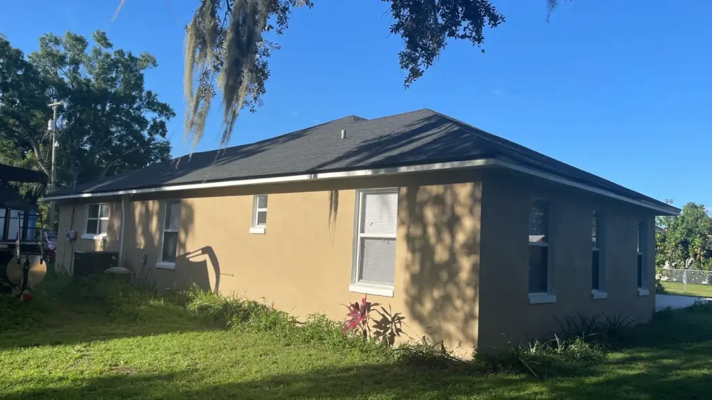 Crew tearing off old roofing during a roof replacement in Polk County, FL