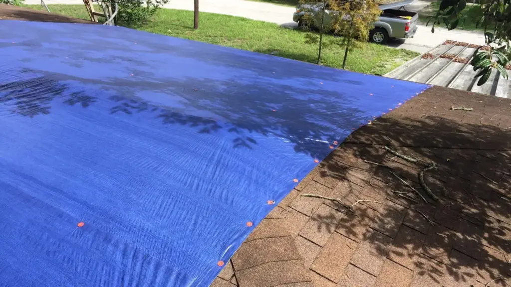 Roof replacement in progress on a Hillsborough County home, decking exposed