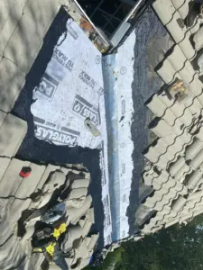 Crew inspecting shingles during a roof repair job in Hillsborough County