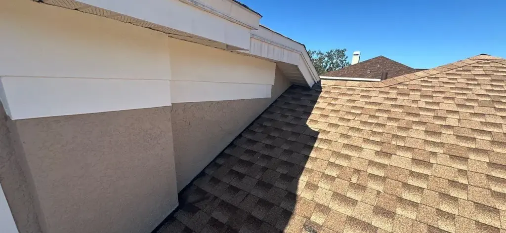 Crew tearing off old roofing down to decking during a roof replacement in Hillsborough County