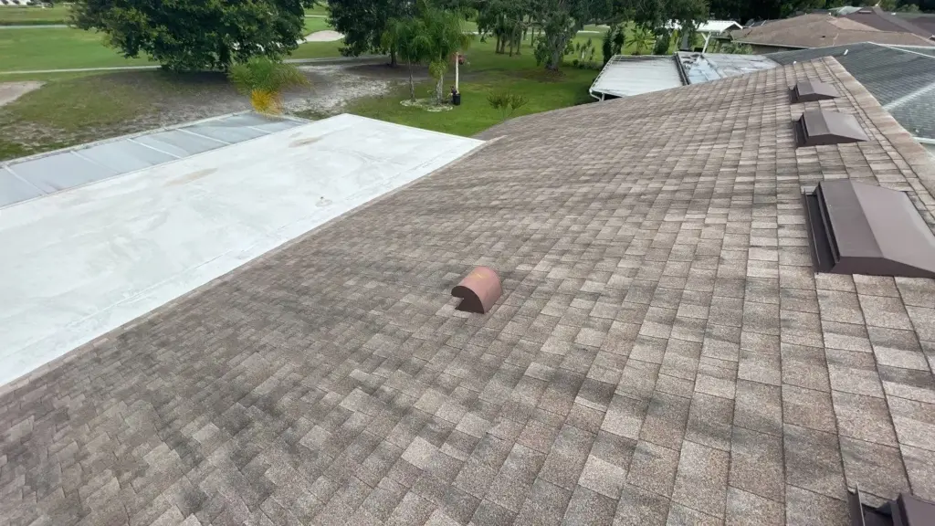 Crew inspecting a roof section before repair in Hillsborough County