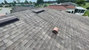 Removing damaged roofing material during a repair job in Hillsborough County