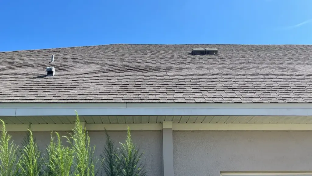 Crew inspecting roof section before repair in Wesley Chapel