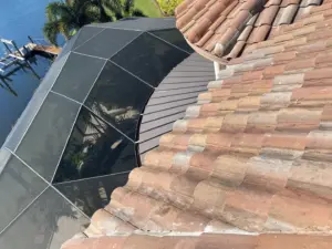 Crew member sealing a repaired section of roof in Riverview, FL