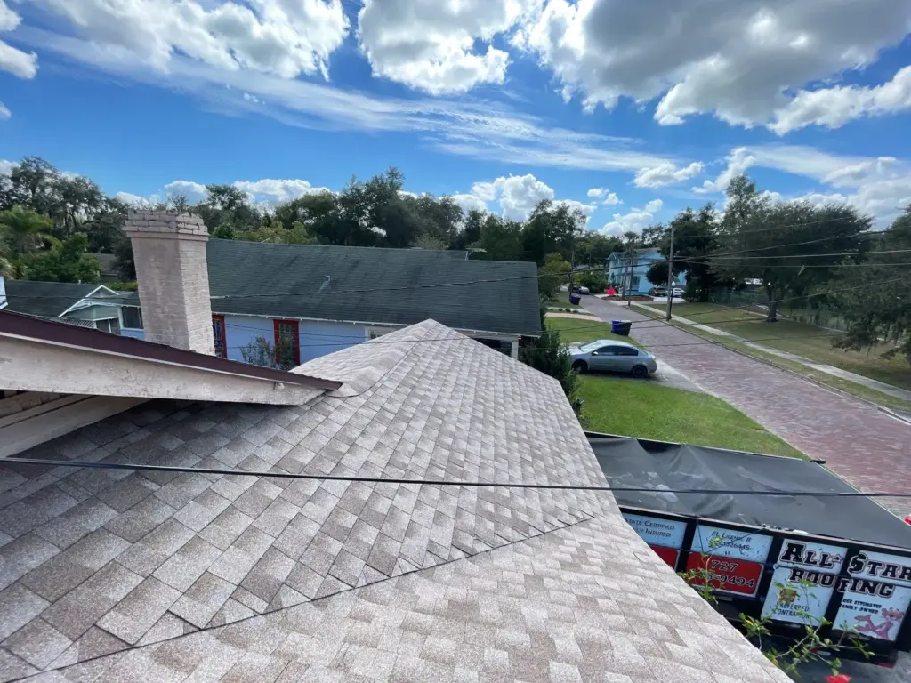 Crew tearing off old roofing during a roof replacement in Polk County, FL