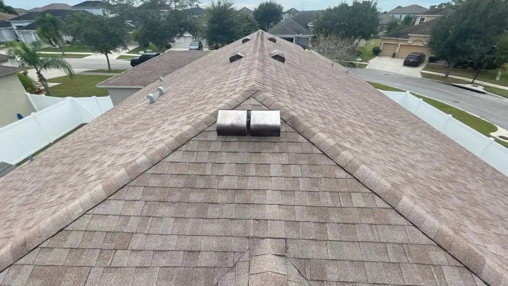 Crew performing roof repair work on a Riverview home