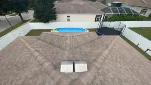 Roofer sealing flashing during a roof repair in Riverview