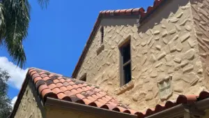 Crew setting tile courses during a St. Petersburg roofing job