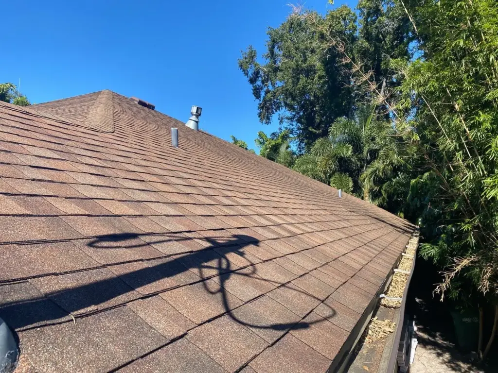 Crew inspecting a roof during a repair job in Hillsborough County