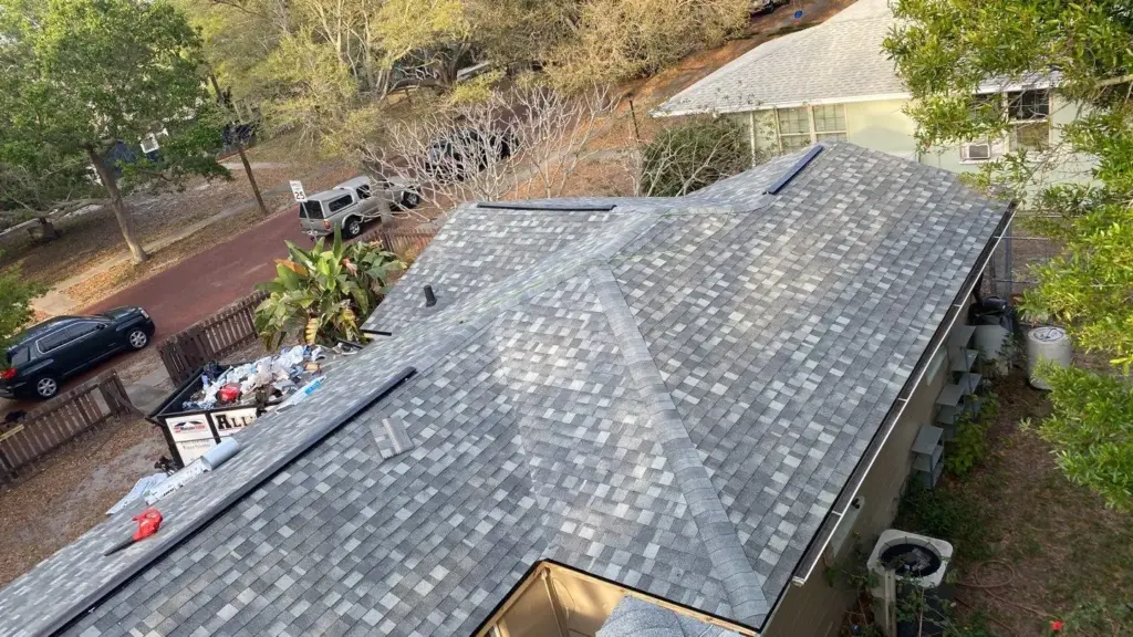 Crew tearing off old roofing during a St. Petersburg roof replacement