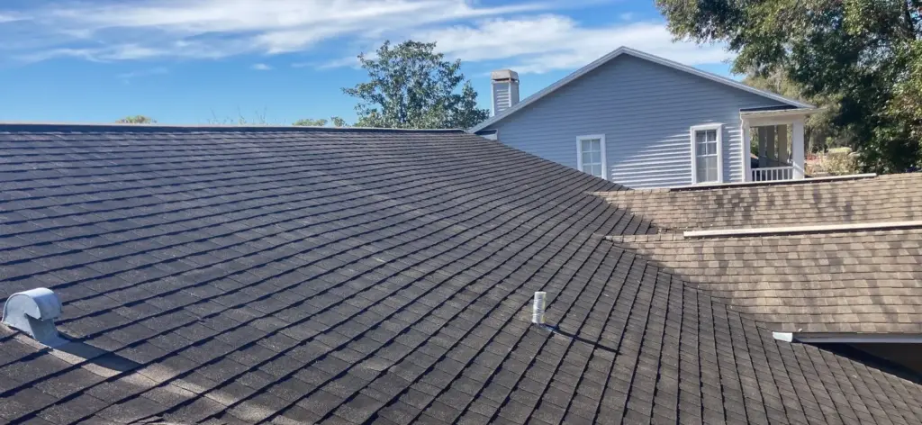 Roof replacement in progress on a Valrico home, deck exposed during tear-off