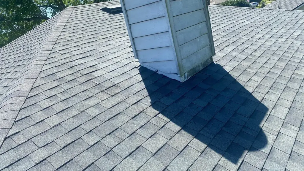 Crew member performing roof repair on a home in Polk County, FL