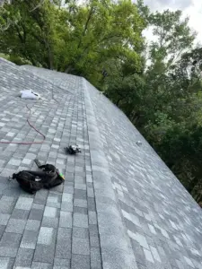 Roofing crew wrapping up a residential roof replacement in Hillsborough County