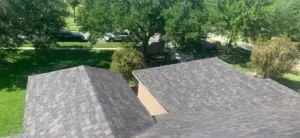 Crew installing new roofing system during a Wesley Chapel roof replacement