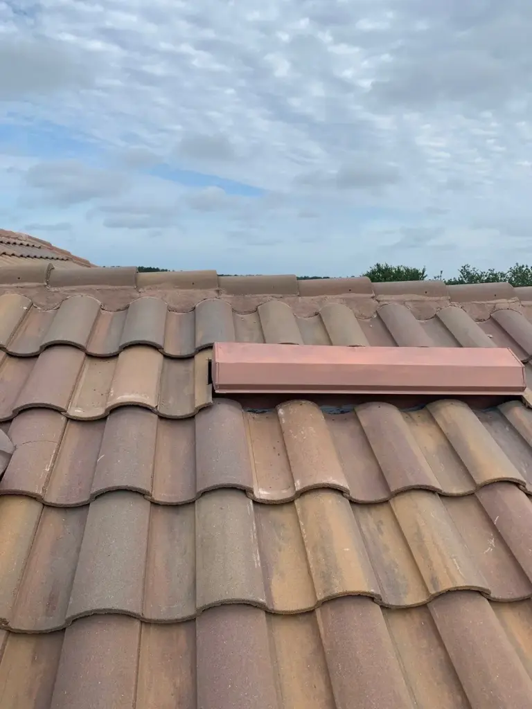 Crew inspecting roof during repair job in Pinellas County