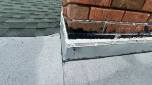 New shingles being installed during roof replacement in Polk County