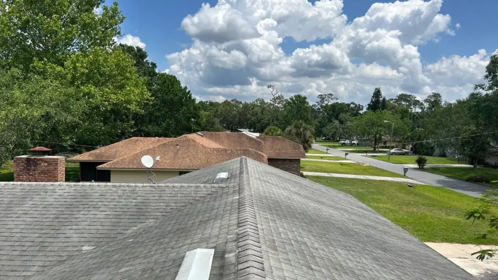 Crew tearing off old roofing during a roof replacement in Polk County, FL