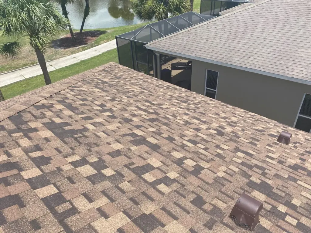 Roof replacement crew tearing off old shingles in Hillsborough County