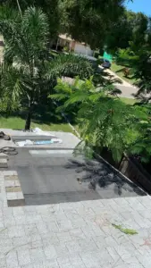 Crew member sealing a repaired section of roof in St. Petersburg