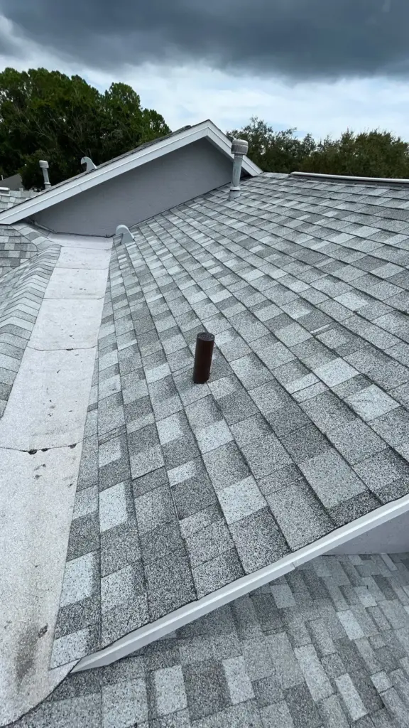 Finished roof replacement on a Hillsborough County home showing new shingles and a clean ridge line