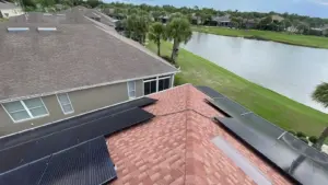 Crew tearing off old shingles during roof replacement in Temple Terrace