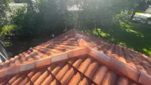 Crew setting tile courses during a Hillsborough County roofing job