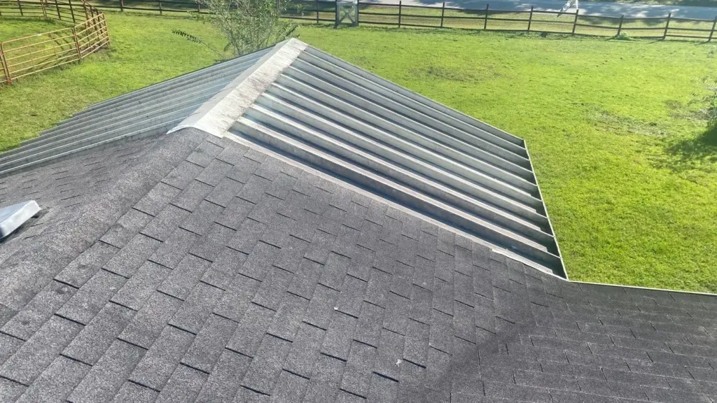 Crew tearing off old roofing during a roof replacement in Polk County