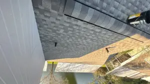 Fresh shingles being installed during a residential roof replacement in Polk County