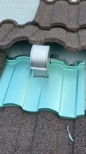 Finished stone-coated metal roof on a St. Petersburg residence