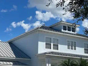 Crew completing roof repair on a Riverview property