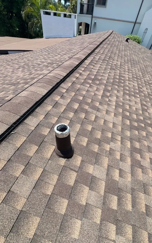Crew tearing off old roofing during a roof replacement in St. Petersburg