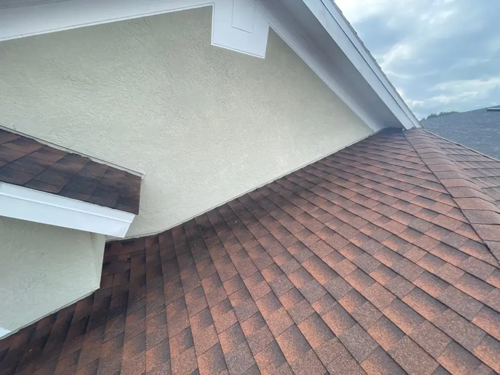 Crew performing roof repair on a Riverview home