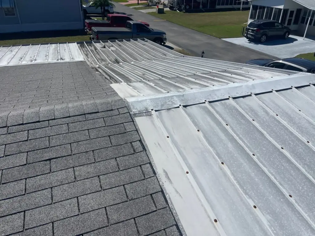 Crew tearing off old roofing during a replacement job in Polk County