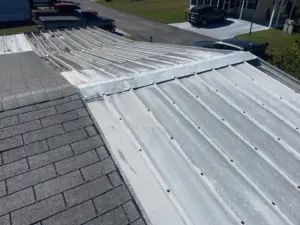 Bare roof deck exposed mid-replacement on a Polk County home