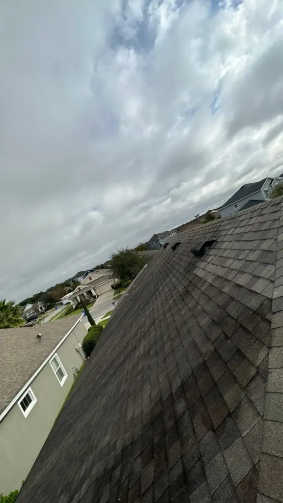 Roofer inspecting a section during a roof repair in Riverview, FL