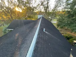Crew tearing off old roofing during a Brandon roof replacement