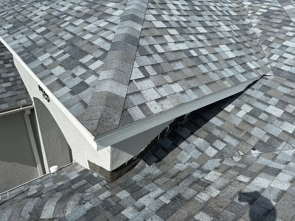 Crew removing old roofing during a roof replacement in Pasco County