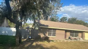 Crew tearing off old roofing during a Polk County roof replacement