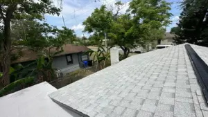Crew installing new roofing system during Polk County replacement job